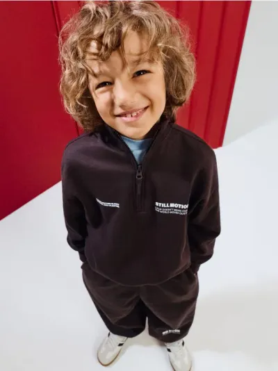 Trenerka half-zip s natpisom