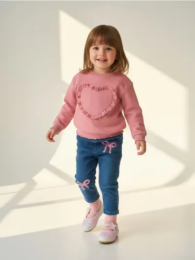 Pull-on farmerke sa šljokicama i motivom mašni