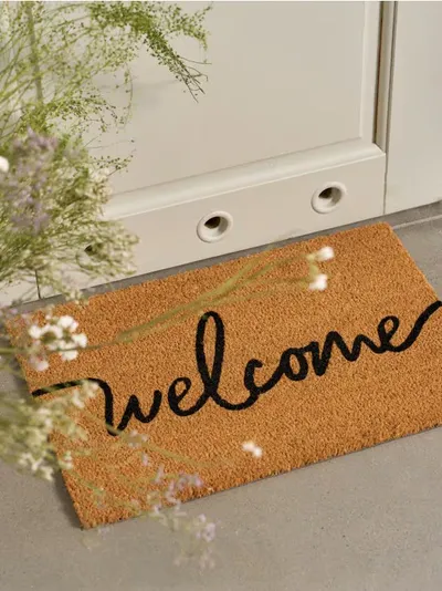 Dozica s natpisom "Welcome"